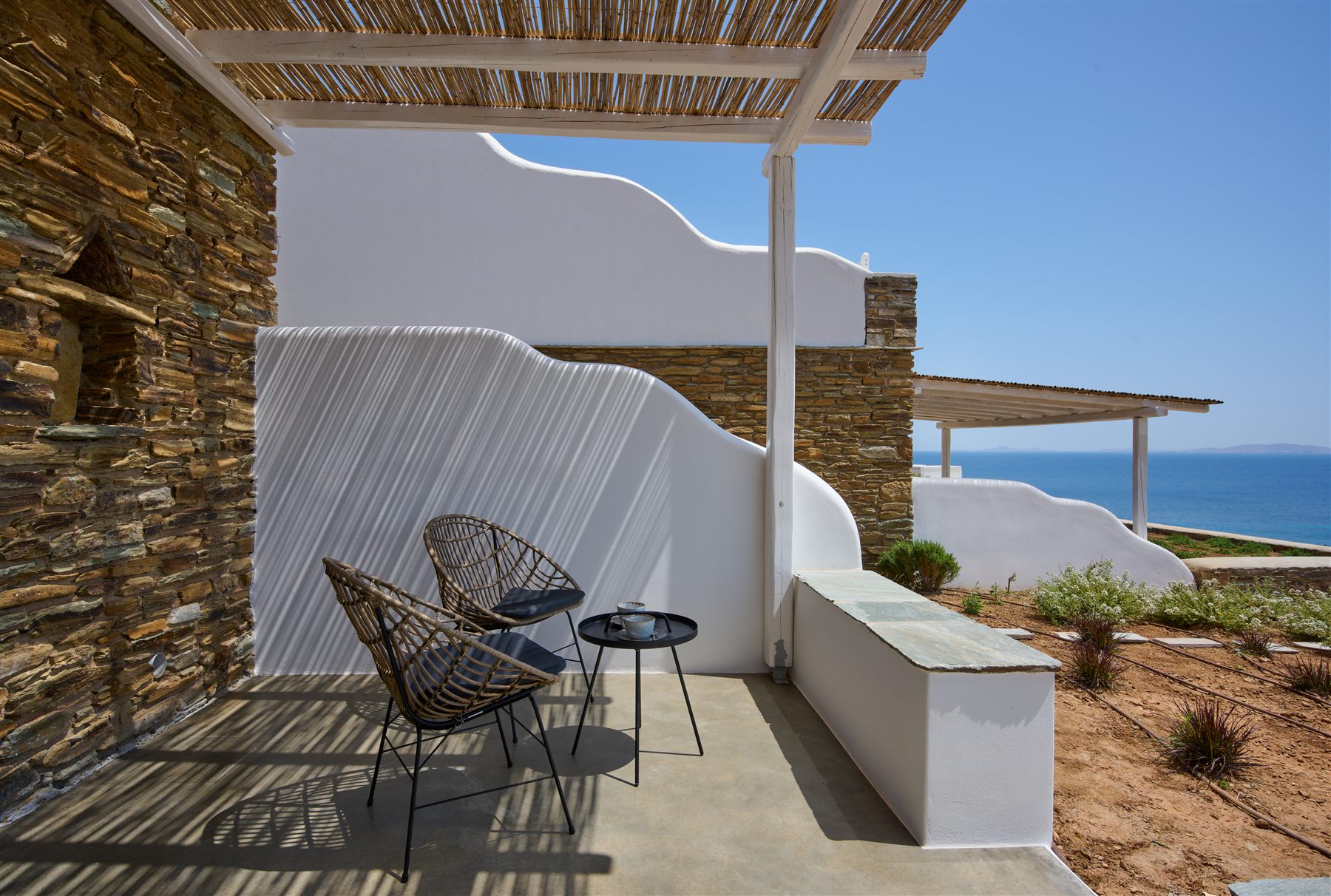 Villa Diana — pergola-shaded terrace over the bay