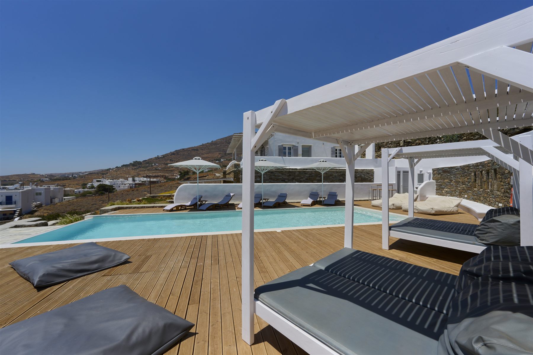 Shaded daybeds by the pool