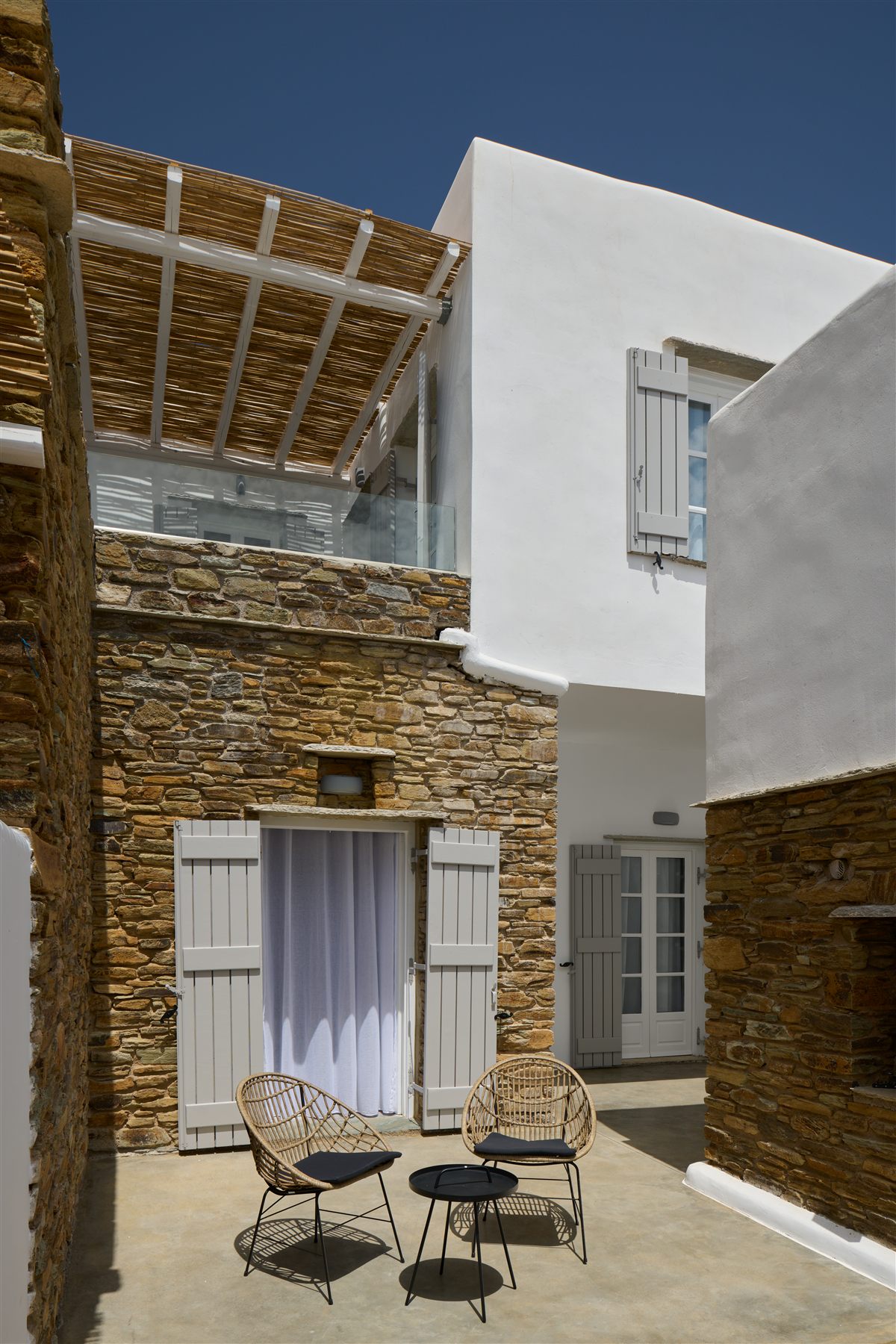 Villa Roxana — sheltered stone courtyard