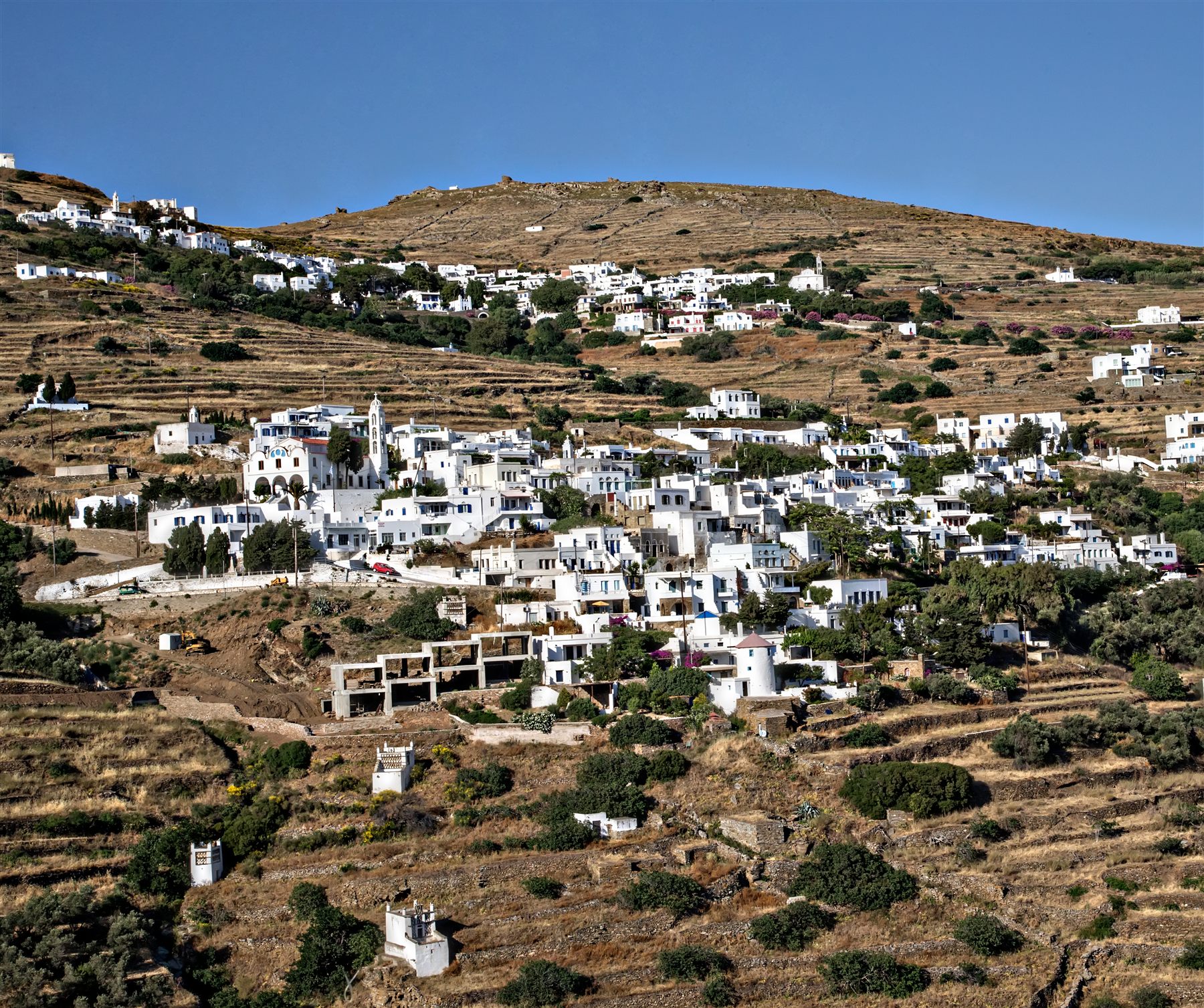Terraced fields and a village on the hillside above the bay